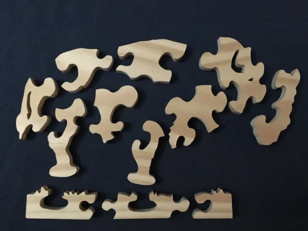 Separated pieces of a wooden buffalo puzzle