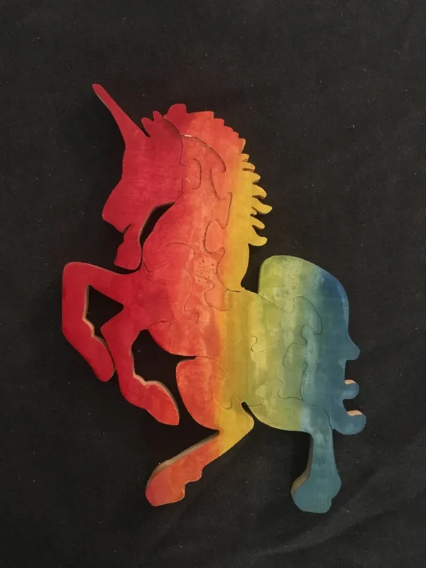 Painted rainbow wooden puzzle of a unicorn