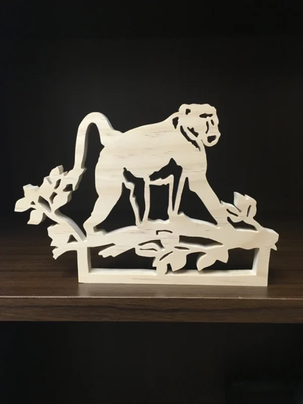 wooden baboon that has been saw scrolled