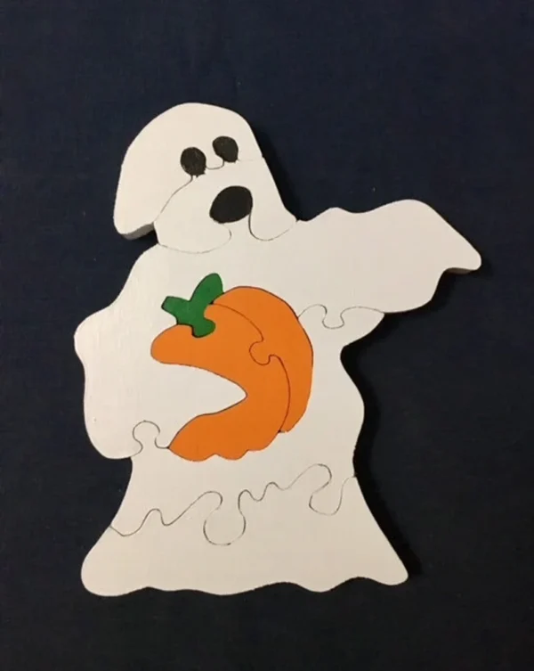 painted wooden ghost stealing a pumpkin