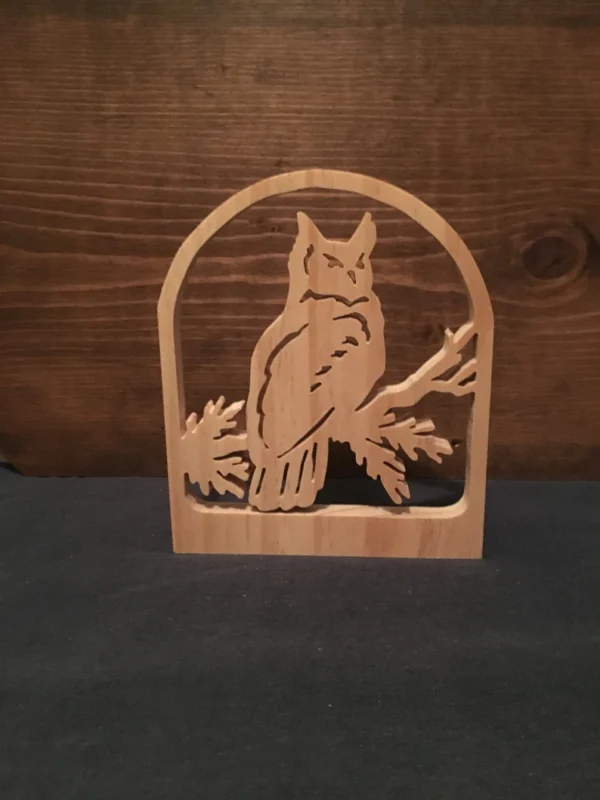 wooden owl sitting on a branch, made from a scroll saw