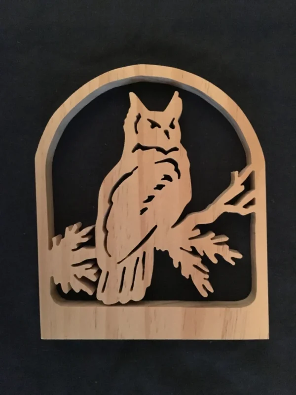 wooden owl sitting on a branch, made from a scroll saw