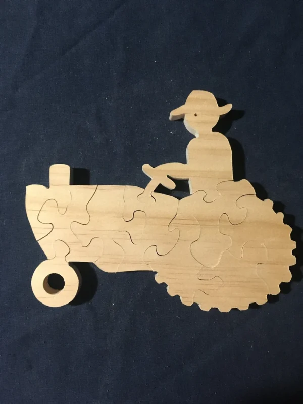 wooden puzzle of a man on a tractor